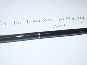 Black Metal Pen with Sample Writing